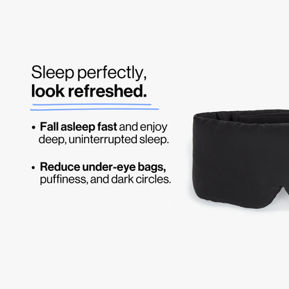 Model wearing black deep sleep mask while relaxing in bed