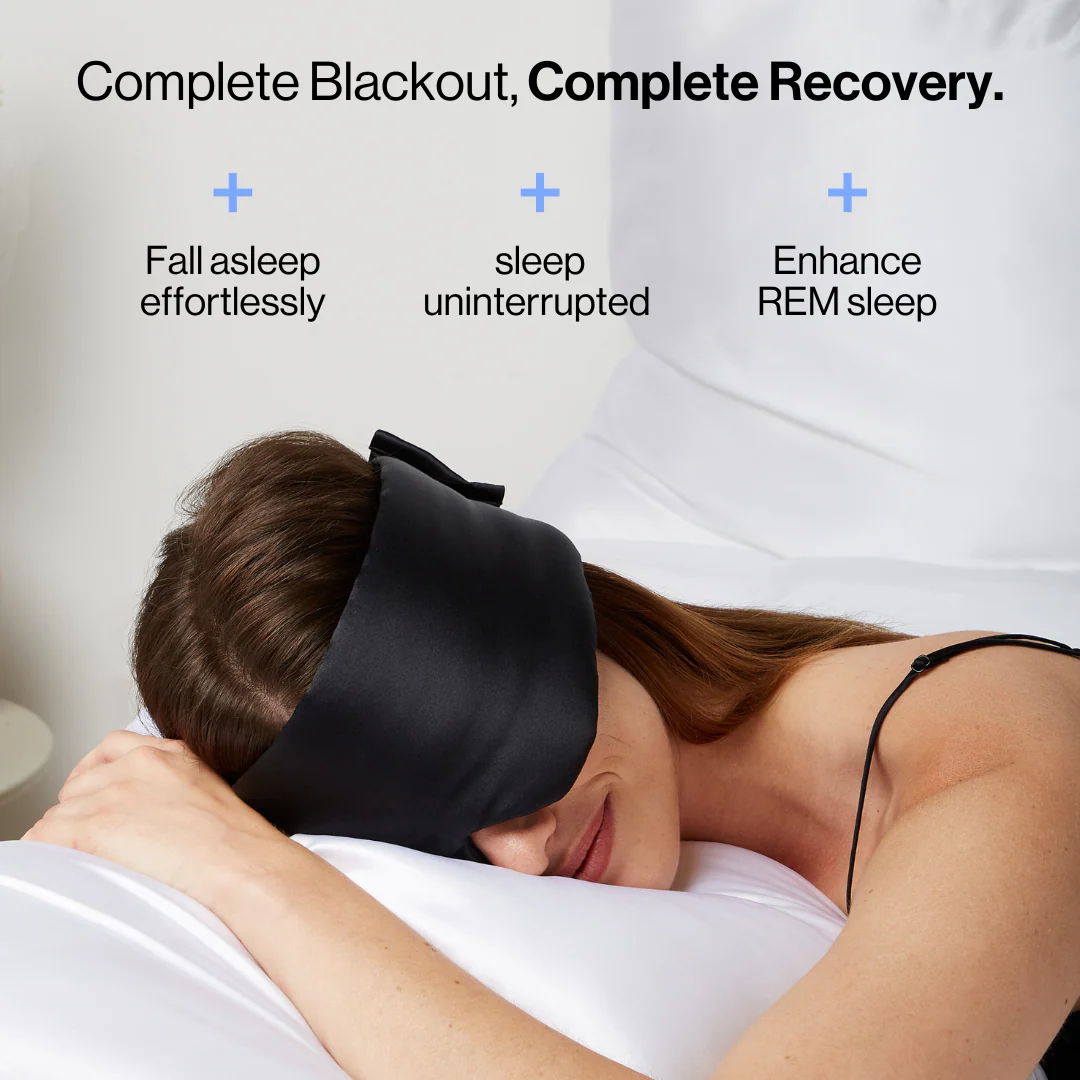 Couple relaxing with black silk deep sleep mask for complete blackout comfort